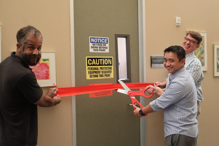 Tony Trinh, Scott Jones, and Sidney Carter cut the ribbon on their new Analytical Development lab.