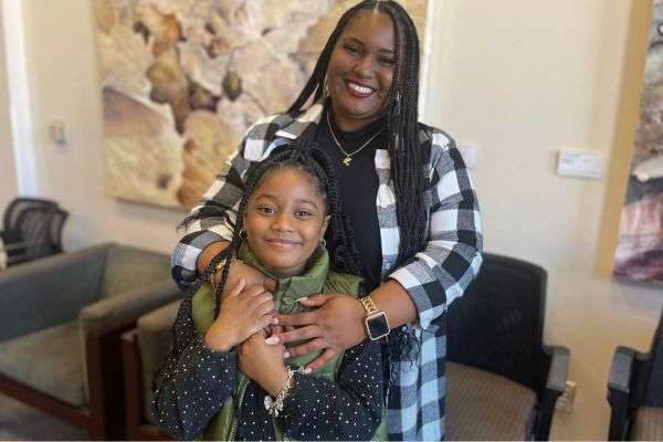 Shanice hugs her daughter Lyric, a sickle cell disease warrior