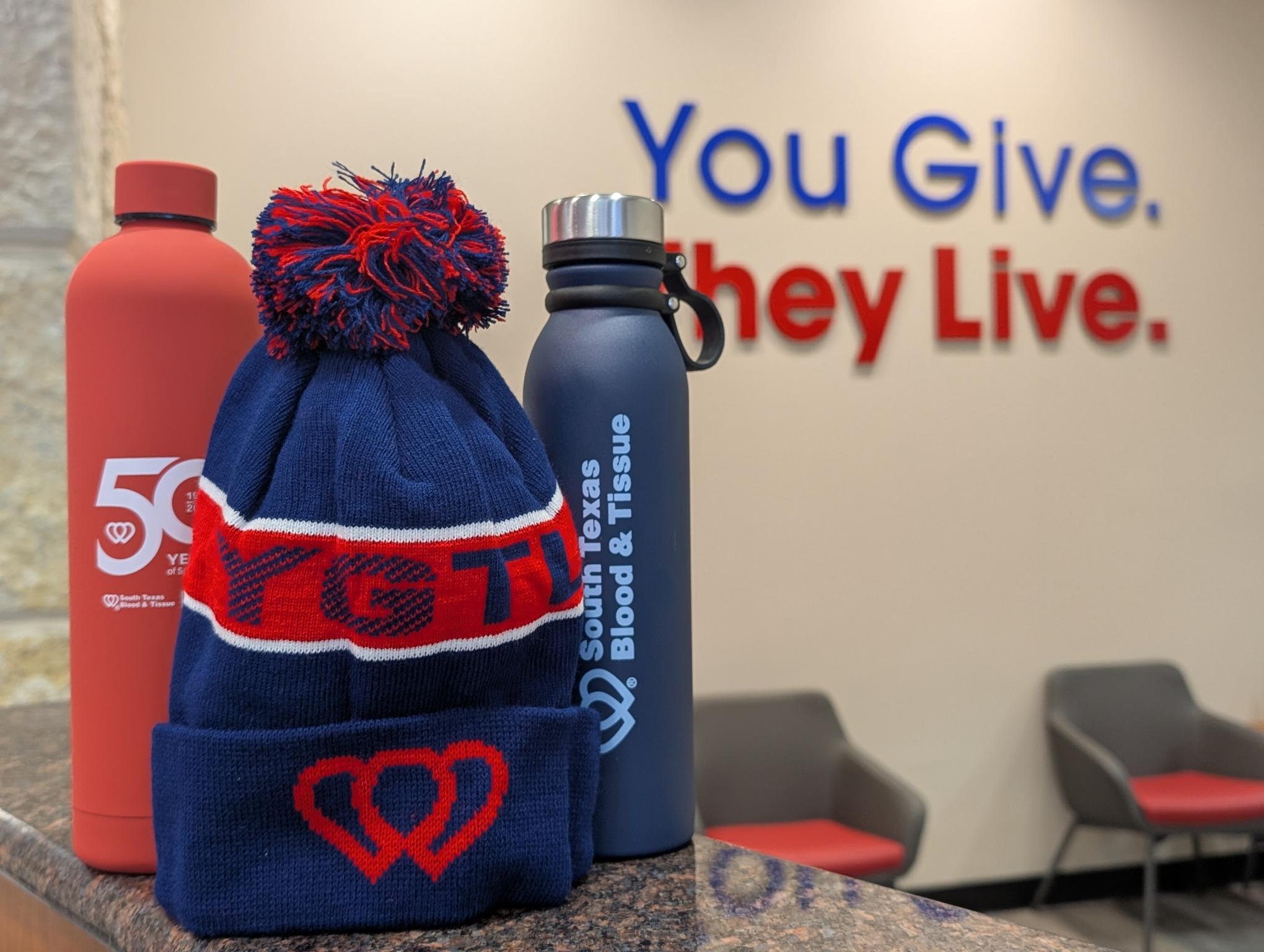 Water bottles and beanies redeemable with points from the donor store