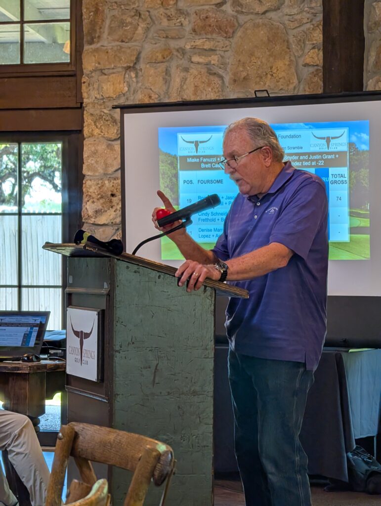 Mike Hogan (HomeSpring Residential Services) speaks at the Driving fore Donors Awards Luncheon