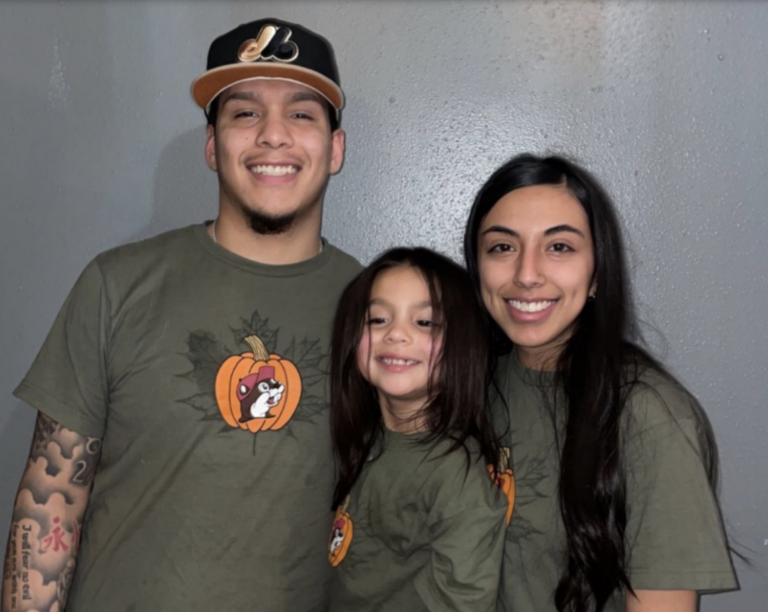 Daniel Michael Moreno smiles with the camera with his family.