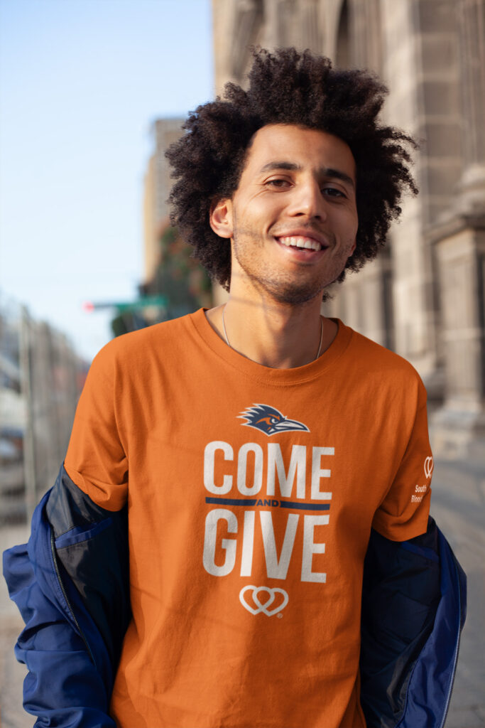 Person wearing Orange Out UTSA T-Shirt, Donate Blood & Score UTSA Tickets