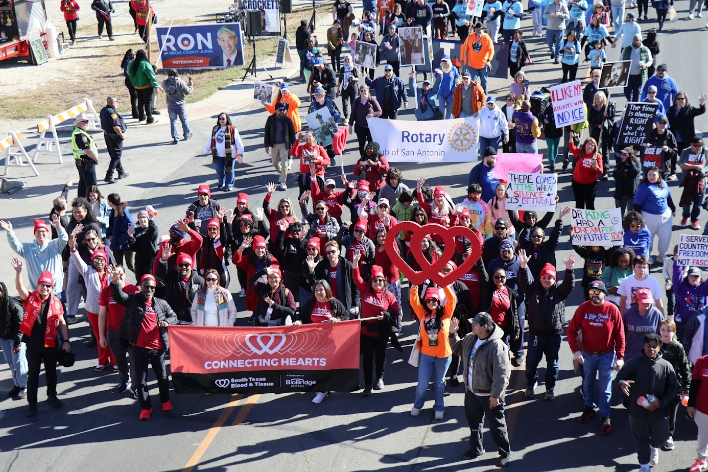 BioBridge Global staff participate in MLK Day March San Antonio with Connecting Hearts banner
