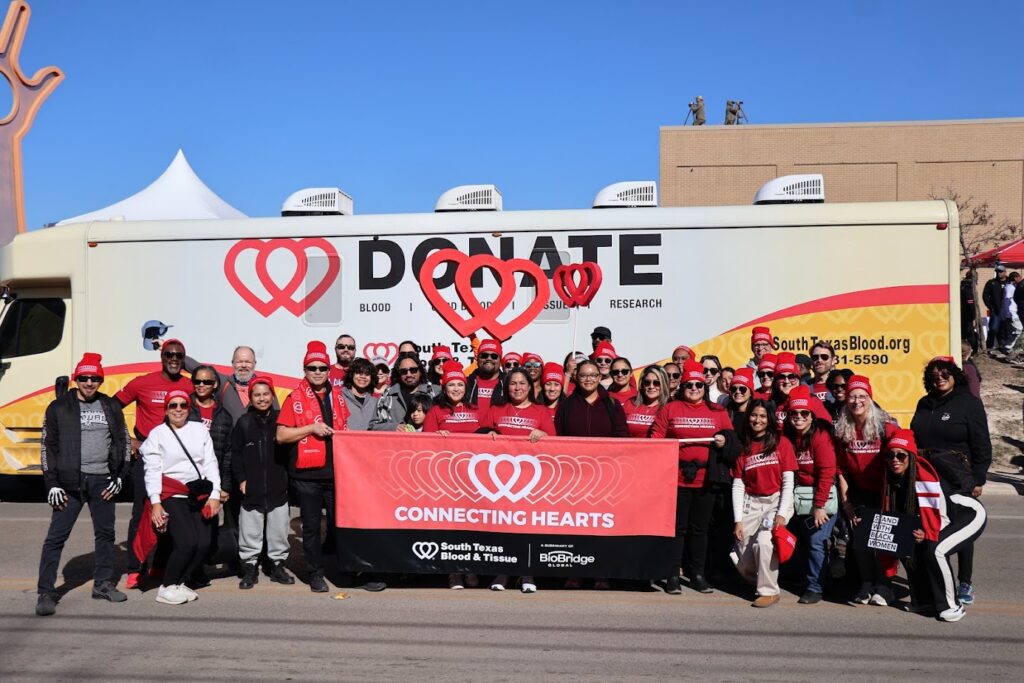BioBridge Global employees gather in front of South Texas Blood & Tissue bus during MLK Day March San Antonio