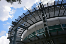 Modern curved building facade with metal canopy